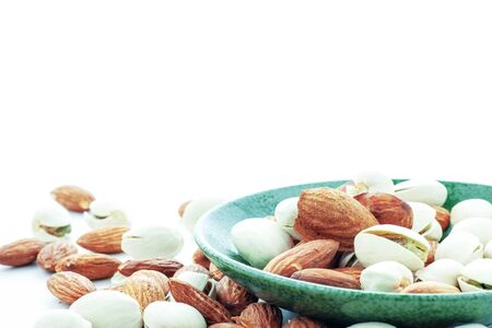 Almond on plate with a white background.の写真素材
