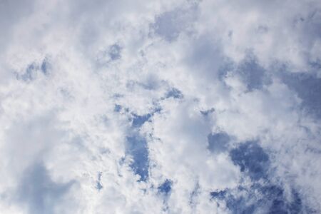 White clouds cover sky in the daytime.の写真素材