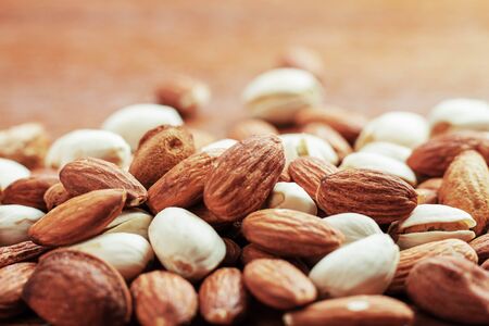 Almond mixed on wooden background.の写真素材