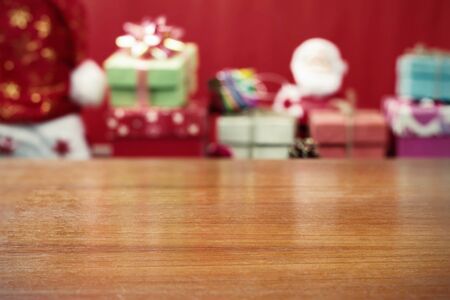 Plank and Christmas gifts with blur image.の写真素材