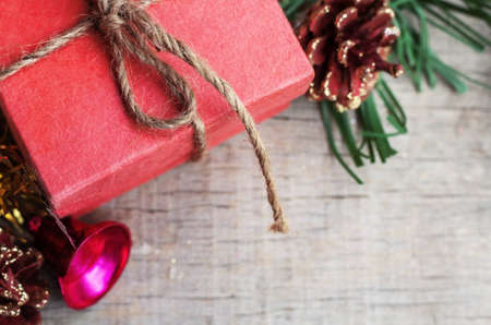Red gift box on the old wooden floor.の写真素材