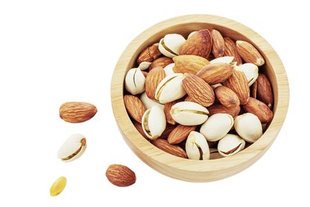 Almond in wooden bowl on a white background.の写真素材