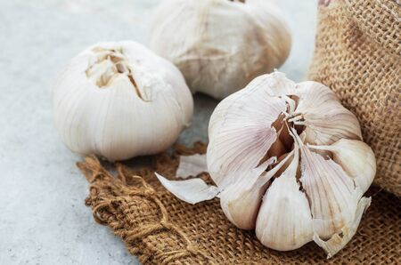 Dry garlic on the old sack.の写真素材
