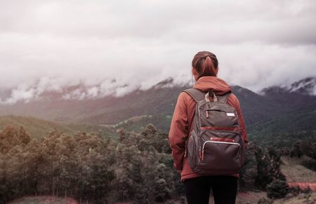 Girl with traveling in nature on the mountain.の写真素材