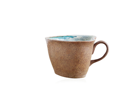 Old coffee mug on a white background.の写真素材