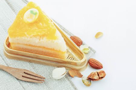 Orange cake on tray with a white background.の写真素材