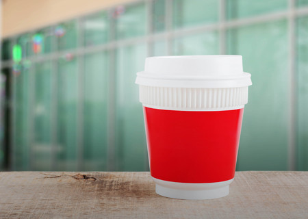 Plastic of coffee cup with the office background.の写真素材
