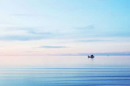 Sea and boat with the blue sky.の写真素材
