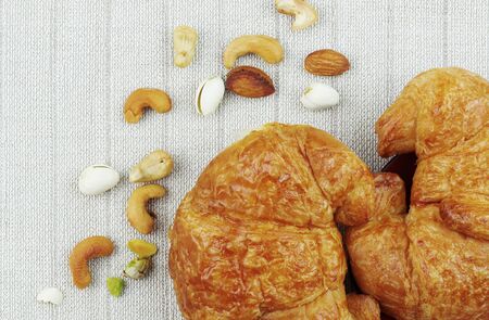 Croissants and beans on a tablecloths.の写真素材