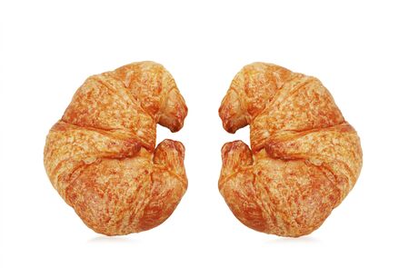 Two yellow croissants with a white background.の写真素材