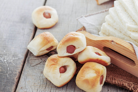 Filled bread and more on a wooden tray.の写真素材