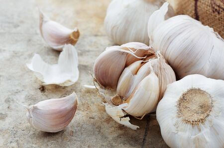 Garlic dried on the old cement floor.の写真素材