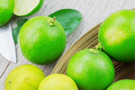 Lime green on tray and the old wooden.の写真素材