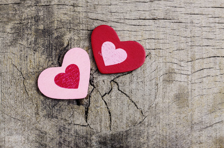 Two hearts on the old wooden floor.の写真素材