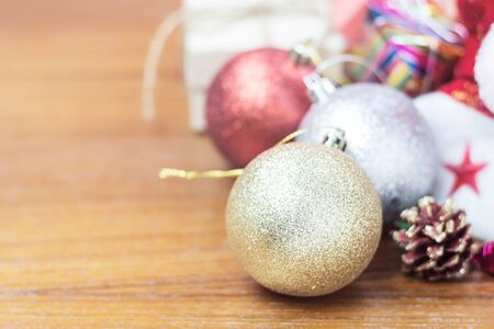 Christmas balls and gift on wooden floors.の写真素材