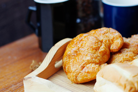 Bread with coffee cup on the table.の写真素材