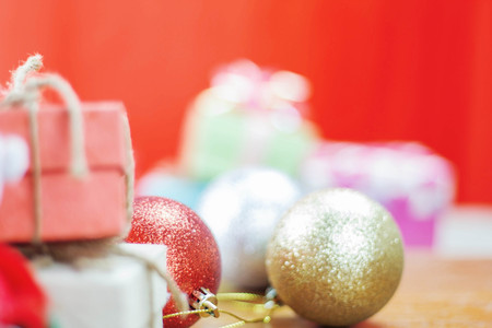 Gift box and ball on wooden floor.の写真素材