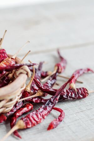 dried chilli in a bowl on wooden.の写真素材