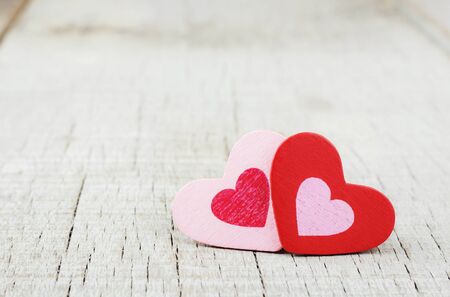 Red and pink hearts on wooden with background.の写真素材