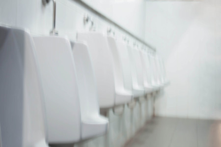Bidet man in the public bathroom.の写真素材