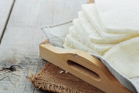 White bread sliced on a wooden tray.の写真素材