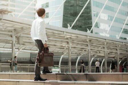 Businessman are walking in the city with sunlight.の写真素材