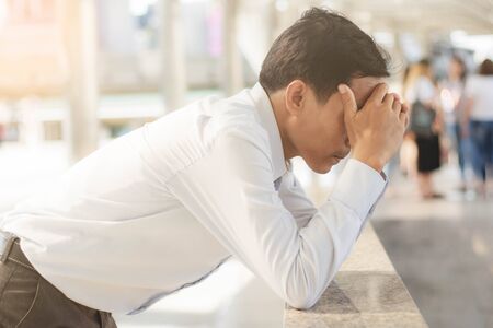 young man was tense because of stress from the work.の写真素材