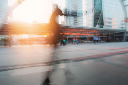 People walking in city with blurred images.の写真素材
