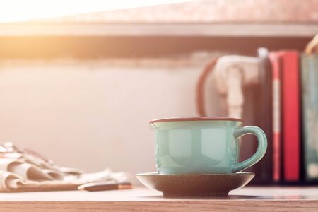 Cup of coffee and books on the desk.の写真素材