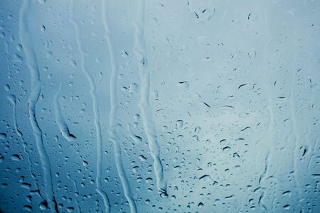 Water drops on glass of falling rain.