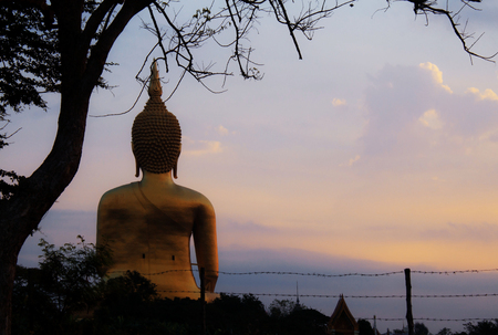 Buddha with sunrise at the sky.の写真素材