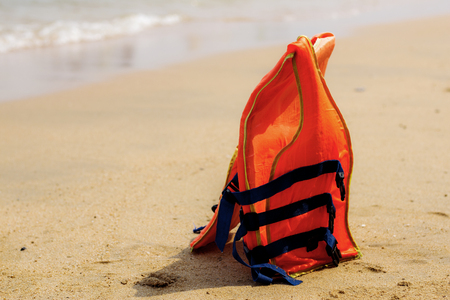 Life jackets on the beach with sunlight.の写真素材