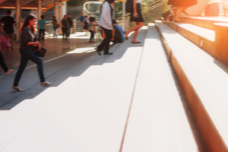 Stairs and people are walking in the evening.の写真素材