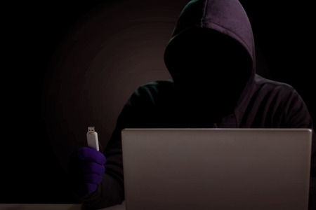 Hackers with flash drives to steal computer data.