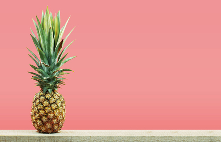 Pineapple on wooden with color background.の写真素材