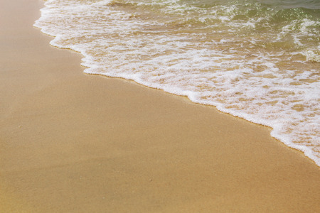Waves and sand beach at the sea.の写真素材