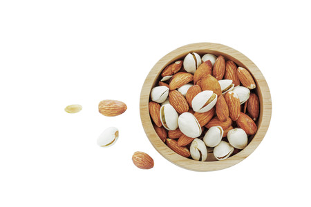 Almond in bowl on a white background.の写真素材