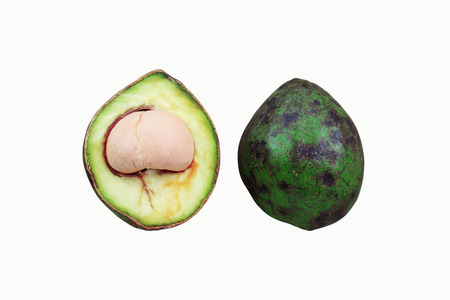 Avocado cut of half on a white background.の写真素材