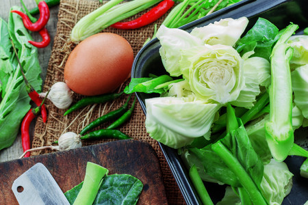Cabbage and eggs prepare food on wooden floor.の写真素材