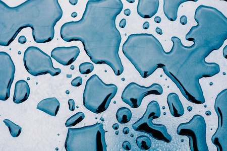 Water droplets and shadows on the rock with of surface.の写真素材