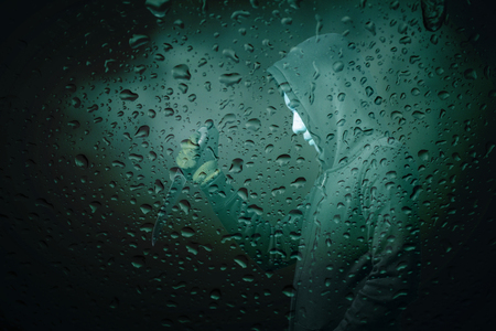 Thieves with scary mystery in shadows at the rain.の写真素材