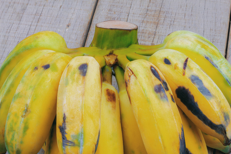 Ripe of banana on wooden background.の写真素材
