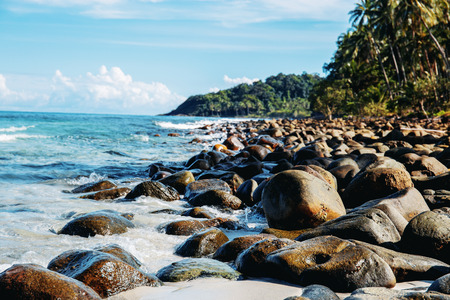 Rocks on shore at the sea with sky.の写真素材