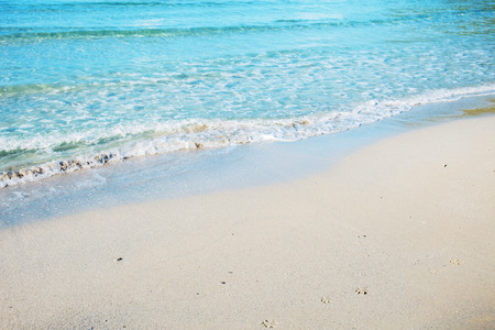 White sand and waves with the beautiful at the sea.の写真素材