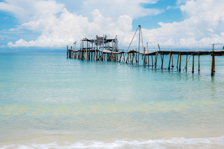 Wooden bridge of old on beach with the sky.の写真素材