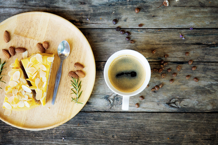 Coffee cup and cake on wooden with top view background.の写真素材