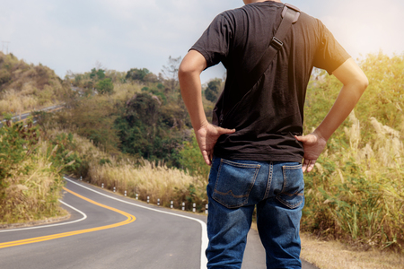 Man are standing on road in the countryside.の写真素材