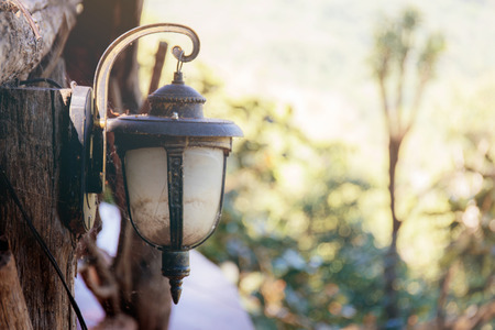 Old lamps decorated on wood in restaurants with the sunlight.の写真素材