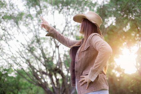 Woman asian in forest with the sunlight.の写真素材