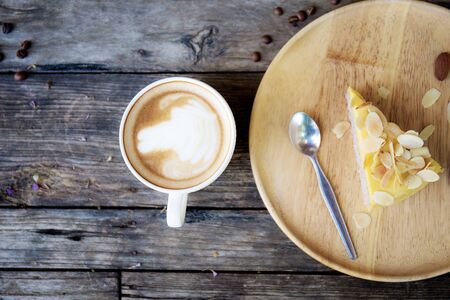 Coffee cup on wooden table with background.の写真素材